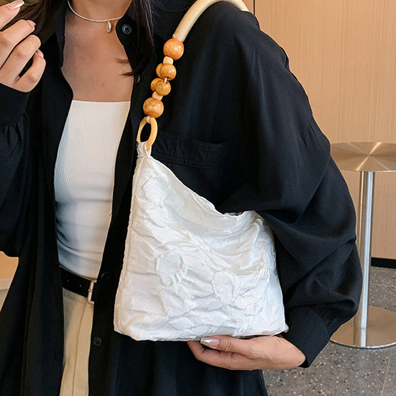 Sacs à main vintage élégants, brodés de fleurs et de perles, pliables.