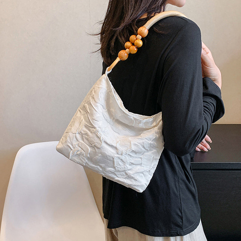 Sacs à main vintage élégants, brodés de fleurs et de perles, pliables.