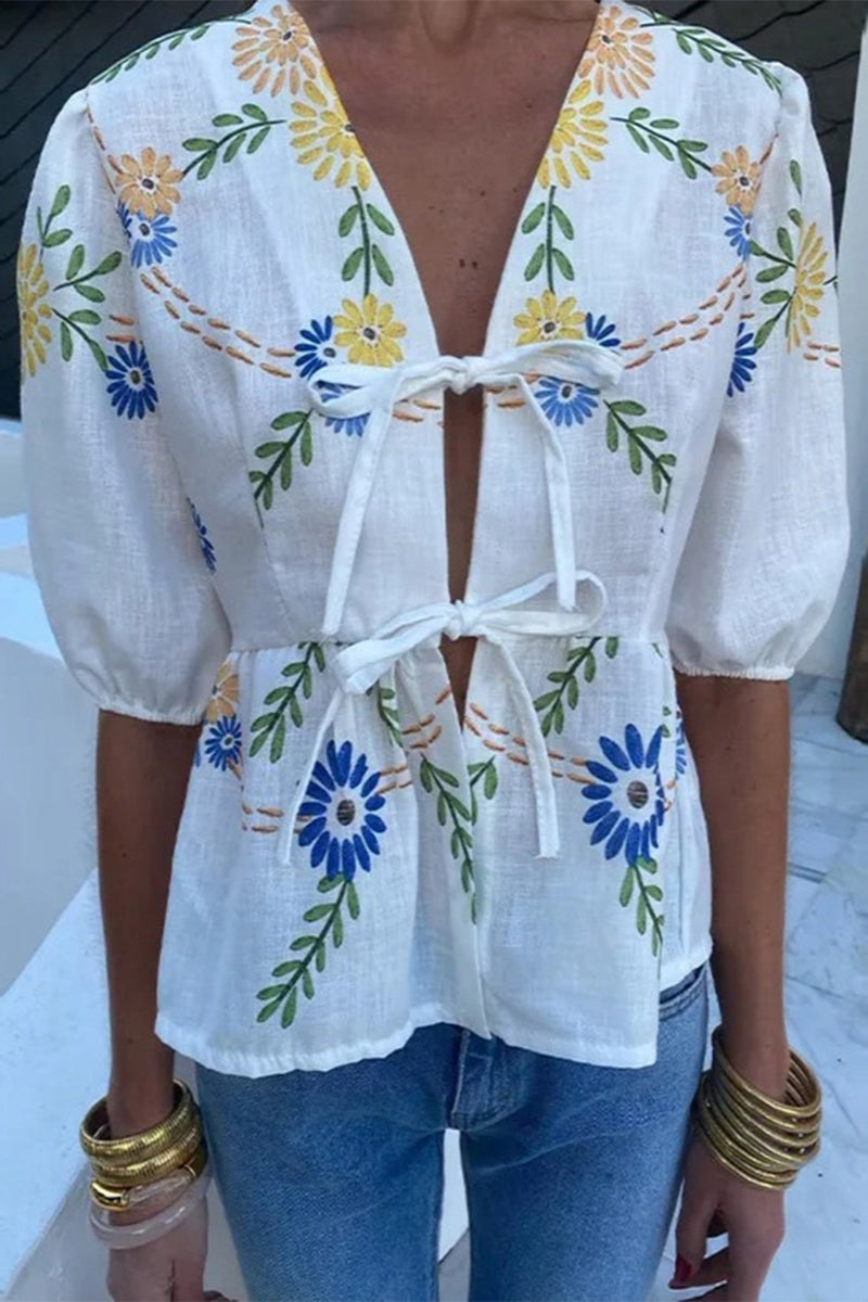 Haut décolleté en V à imprimé floral, coupe décontractée, sans positionnement précis.