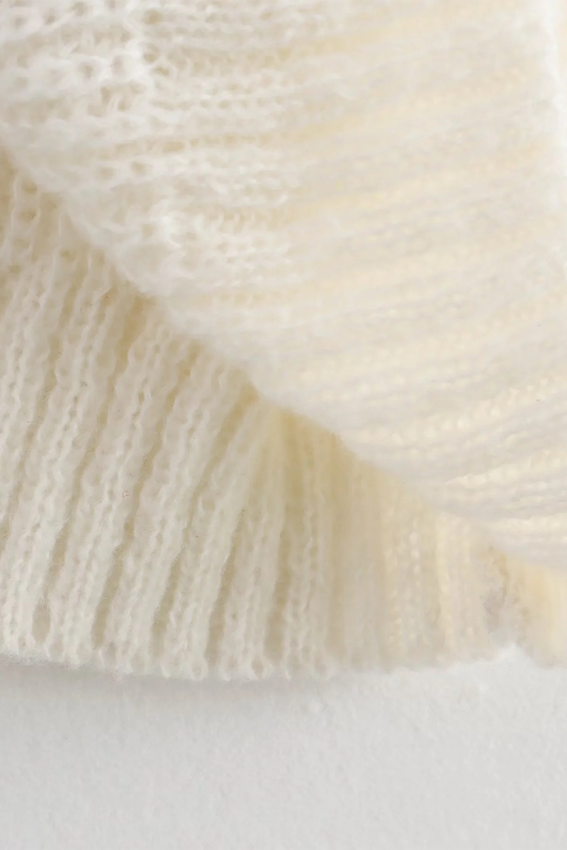 Pull casual à col rond, avec patchs et contrastes, et nœud.