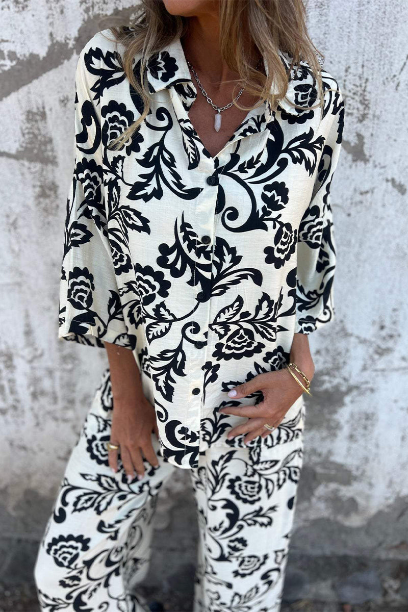 Ensemble deux pièces décontracté à manches trois quarts, col montant contrasté, imprimé floral et poches.