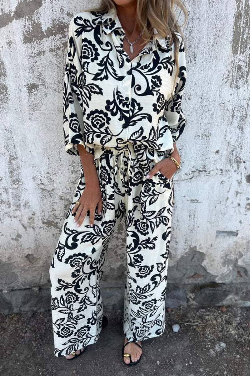 Ensemble deux pièces décontracté à manches trois quarts, col montant contrasté, imprimé floral et poches.