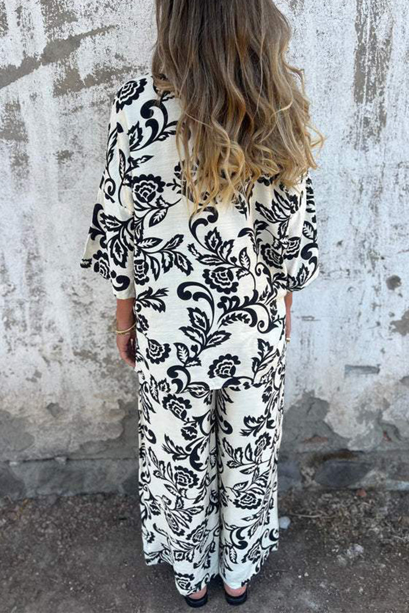 Ensemble deux pièces décontracté à manches trois quarts, col montant contrasté, imprimé floral et poches.